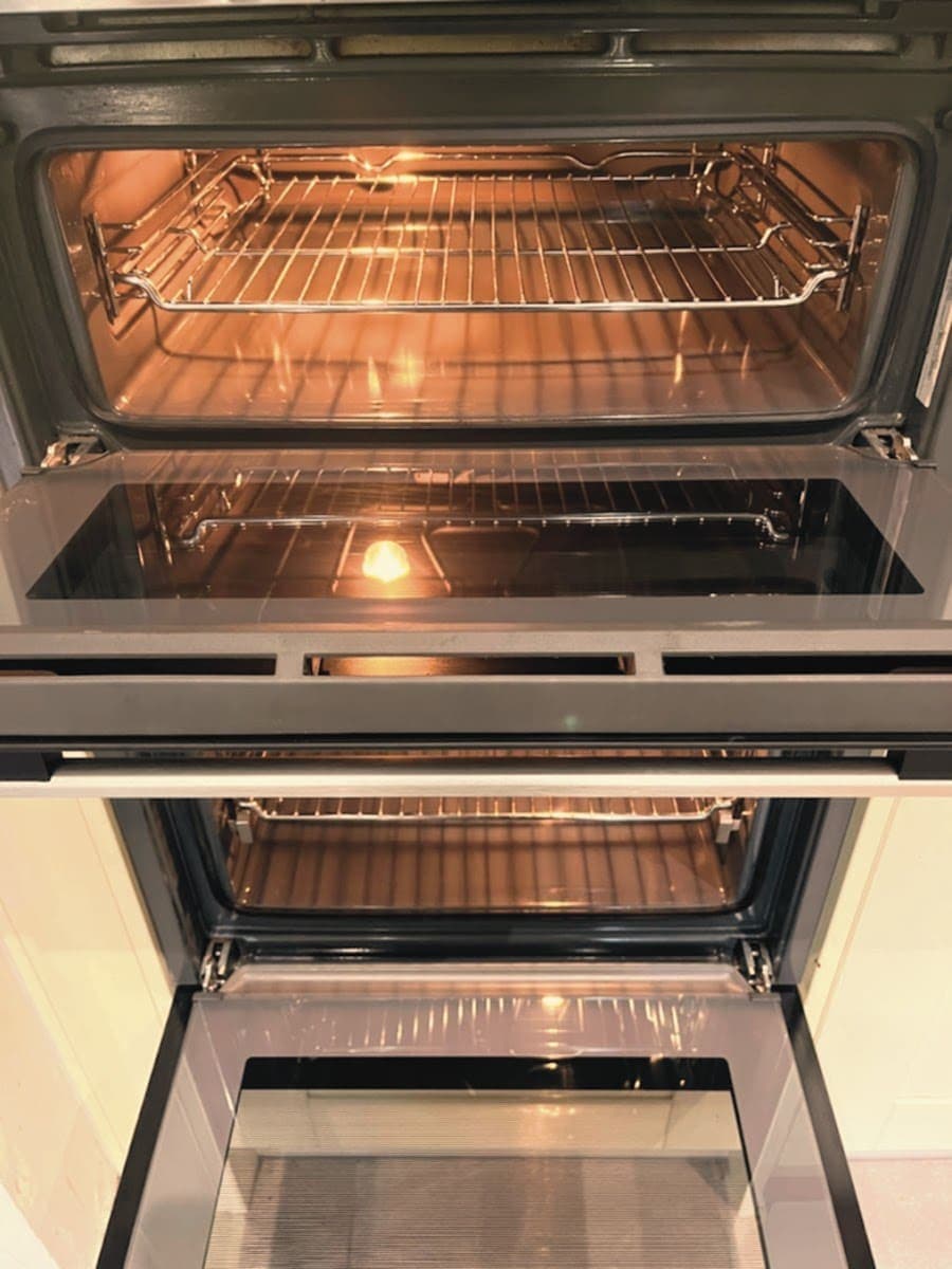 Double oven with both cavities cleaned, lit and ready to use