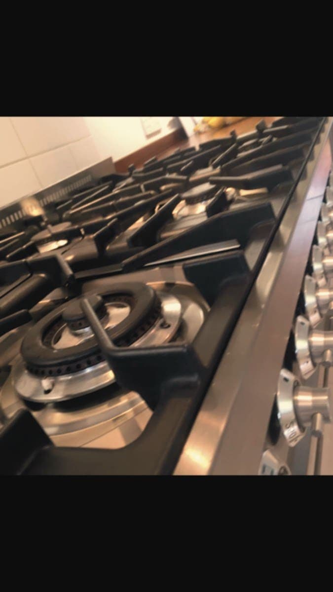 Range cooker gas hob with burners and pan supports cleaned
