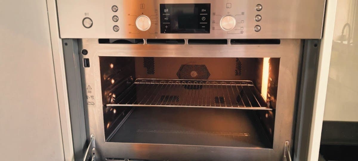 Single oven with the door open after a deep clean
